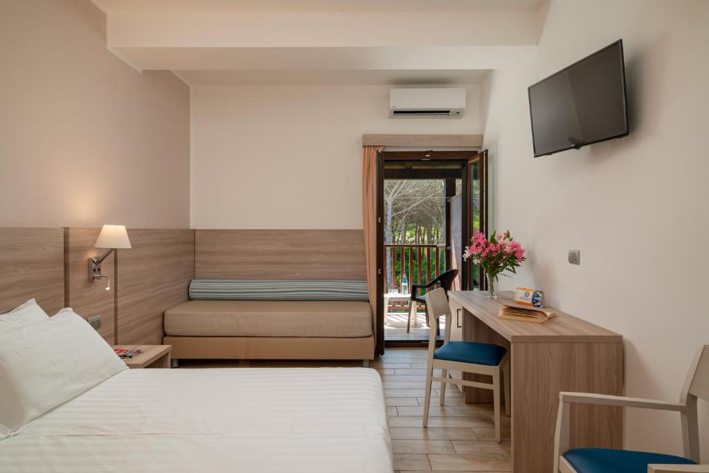 Een bed of bedden in een kamer bij Hotel Portoconte