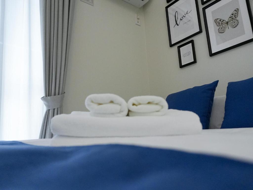 Postel nebo postele na pokoji v ubytování OUCHI HOTEL Onaganishi
