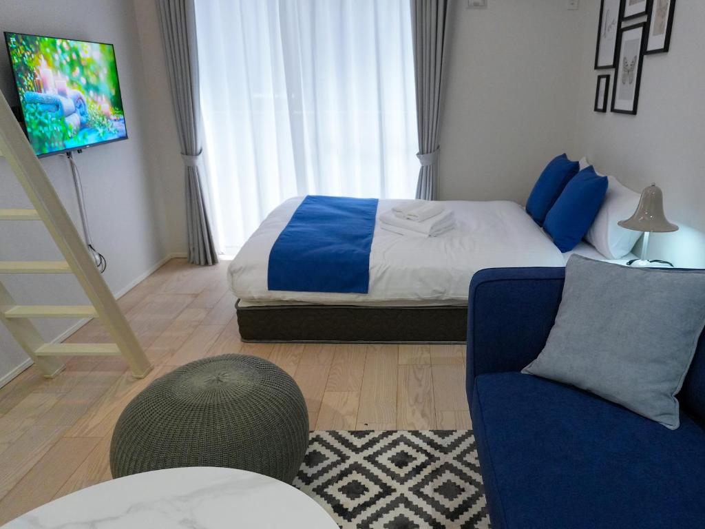 Postel nebo postele na pokoji v ubytování OUCHI HOTEL Onaganishi