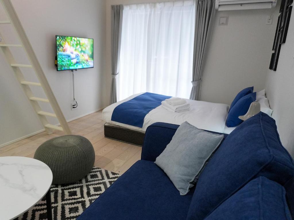 Postel nebo postele na pokoji v ubytování OUCHI HOTEL Onaganishi