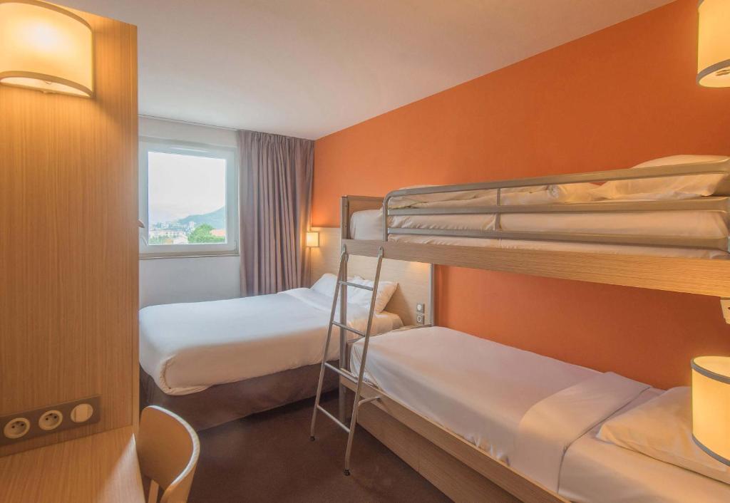 Postel nebo postele na pokoji v ubytování B&B HOTEL Gap