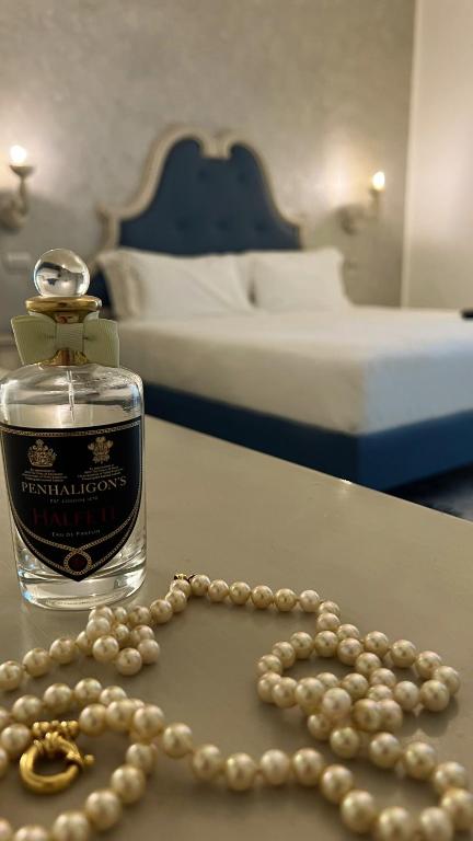 A bed or beds in a room at PLAZA Boutique Hotel - Tropea