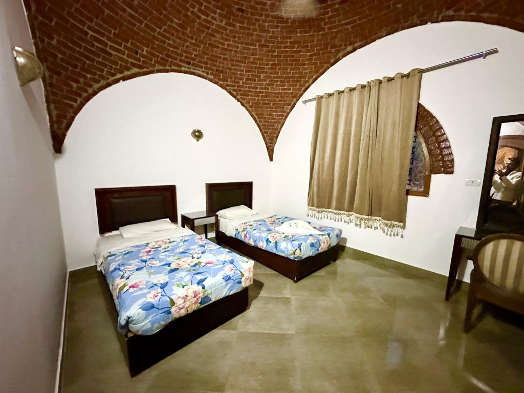 Postel nebo postele na pokoji v ubytování Sheherazade Hotel Nile Villa