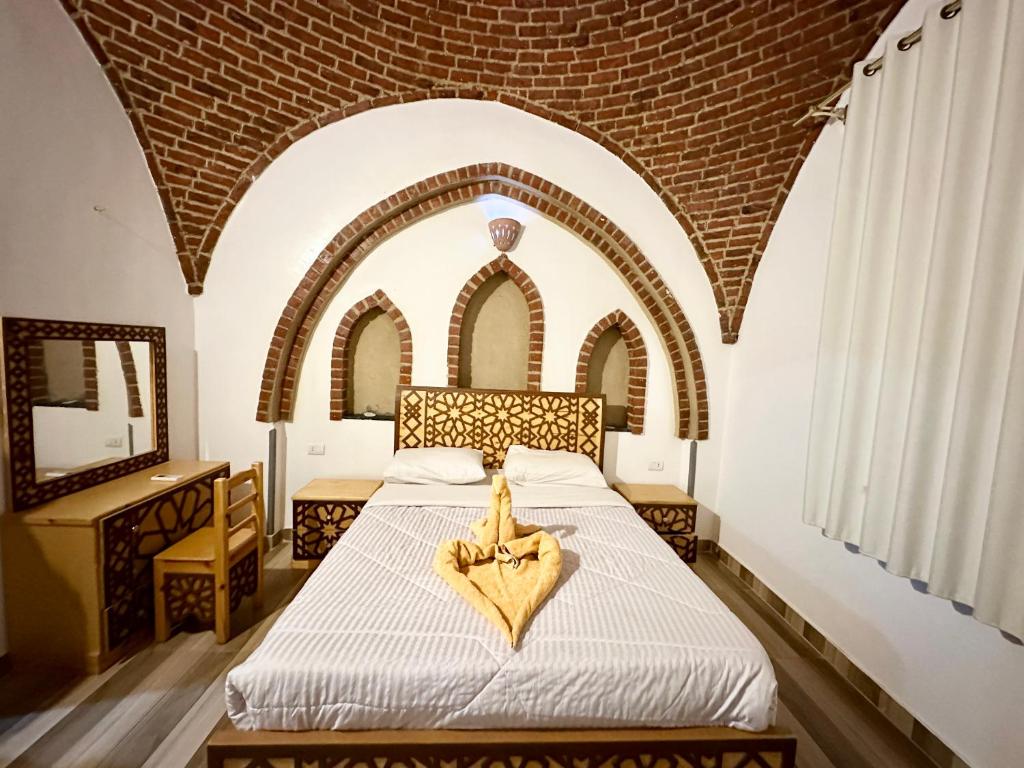 Postel nebo postele na pokoji v ubytování Sheherazade Hotel Nile Villa