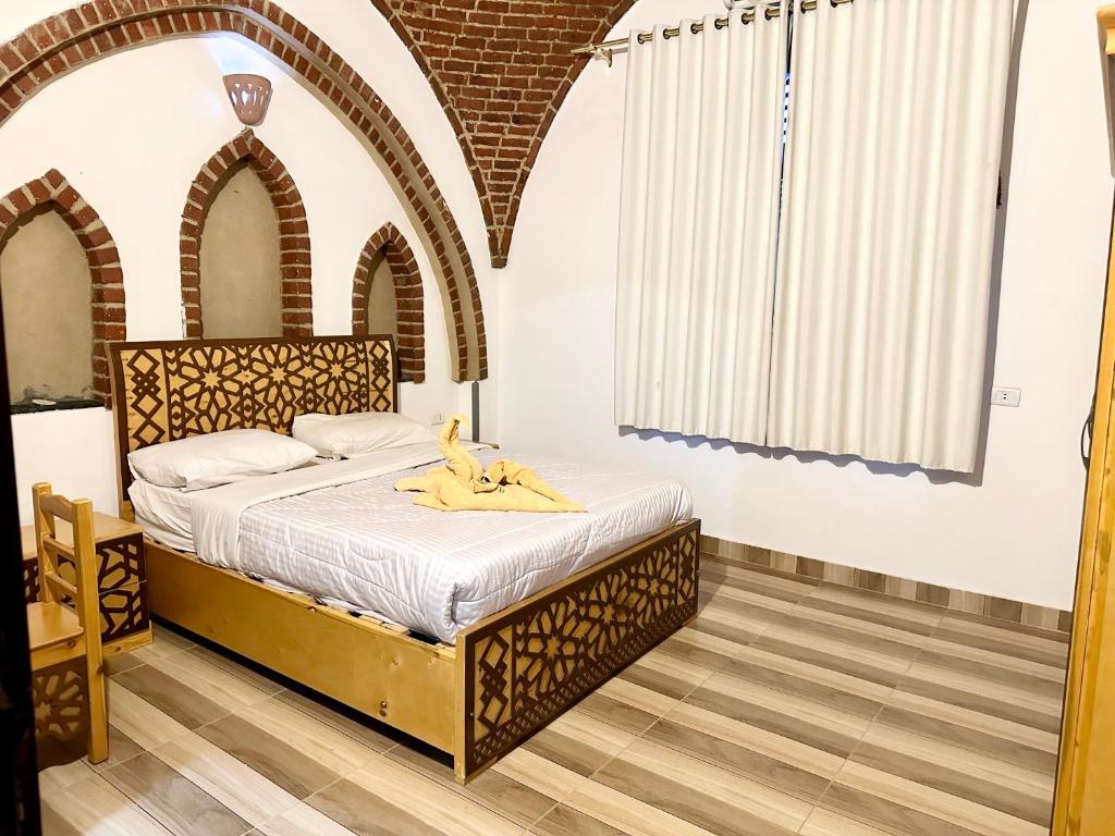 Postel nebo postele na pokoji v ubytování Sheherazade Hotel Nile Villa
