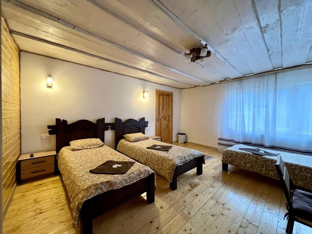 Postel nebo postele na pokoji v ubytování Готель-кафе Чатина