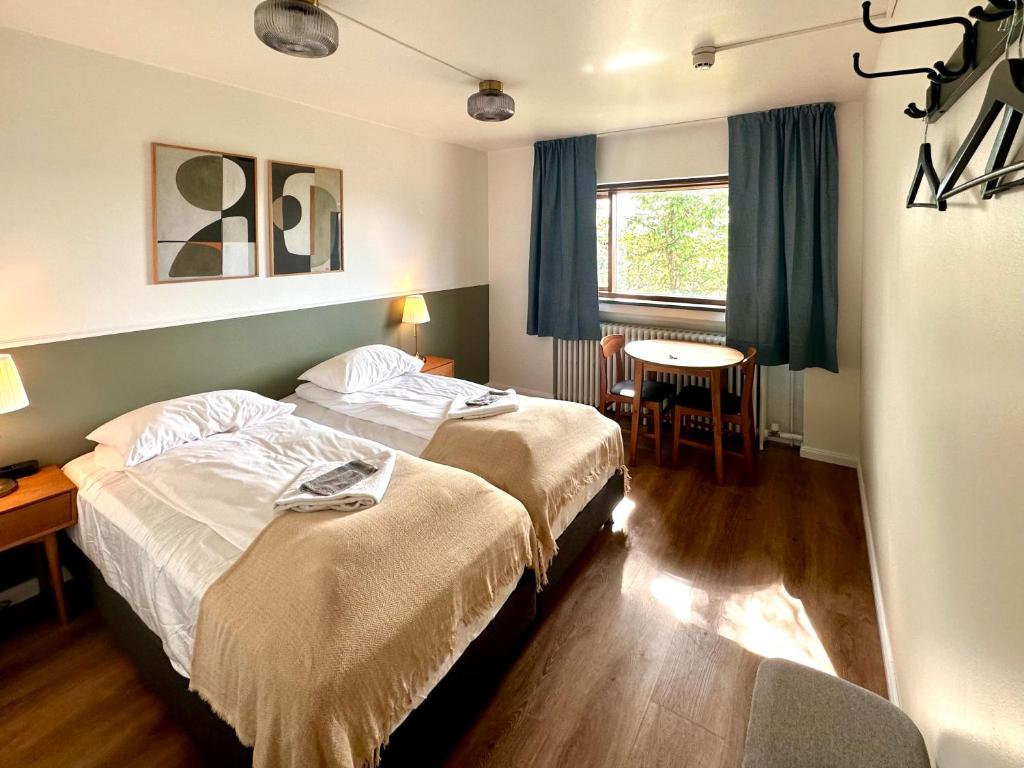 Postel nebo postele na pokoji v ubytování Travel Inn