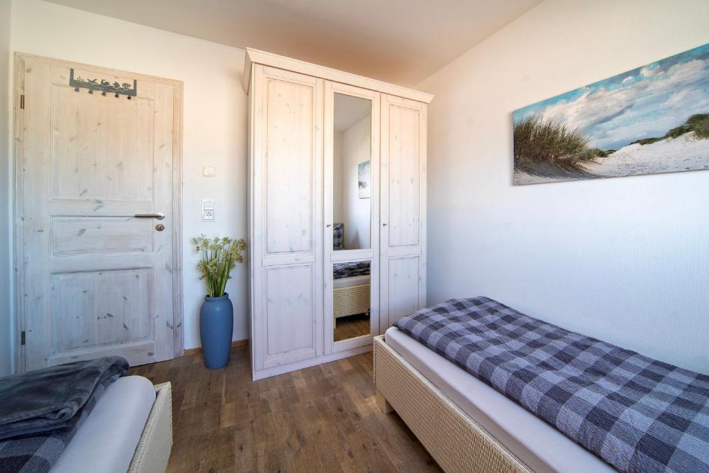 Postel nebo postele na pokoji v ubytování Ferienhaus Strand Hus by Seeblick Ferien ORO, Bestlage am Strand,Sauna,Kamin