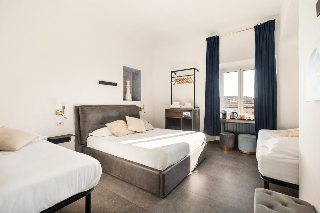 En eller flere senge i et værelse på R.C. Vatican View