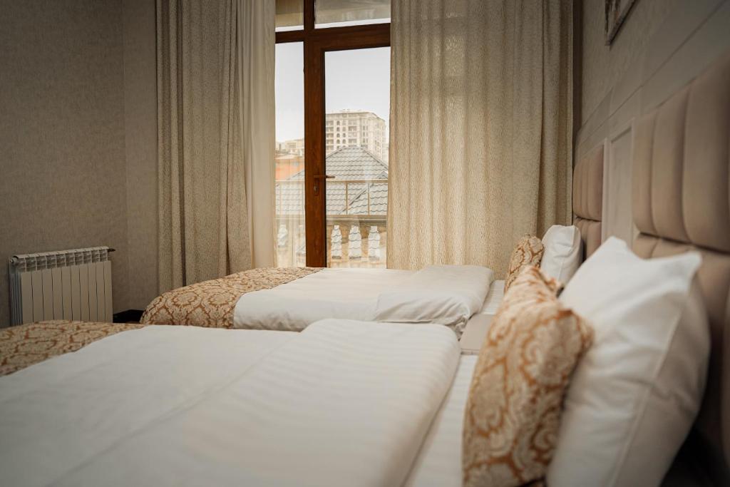 Postel nebo postele na pokoji v ubytování Safran Hotel