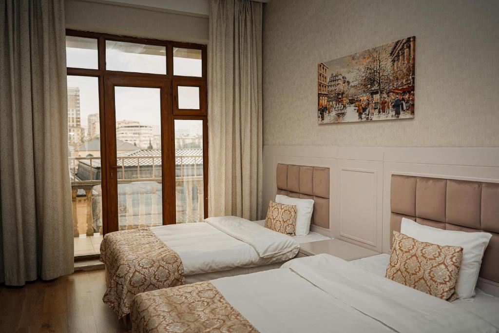 Postel nebo postele na pokoji v ubytování Safran Hotel