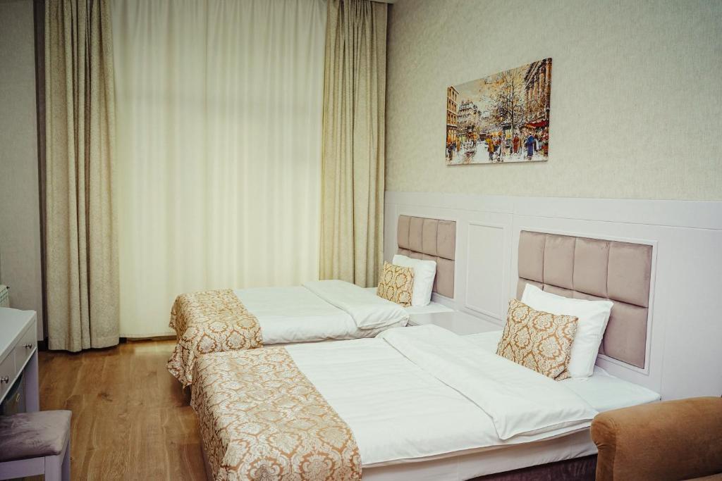 Postel nebo postele na pokoji v ubytování Safran Hotel