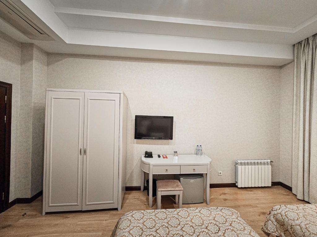 TV a/nebo společenská místnost v ubytování Safran Hotel