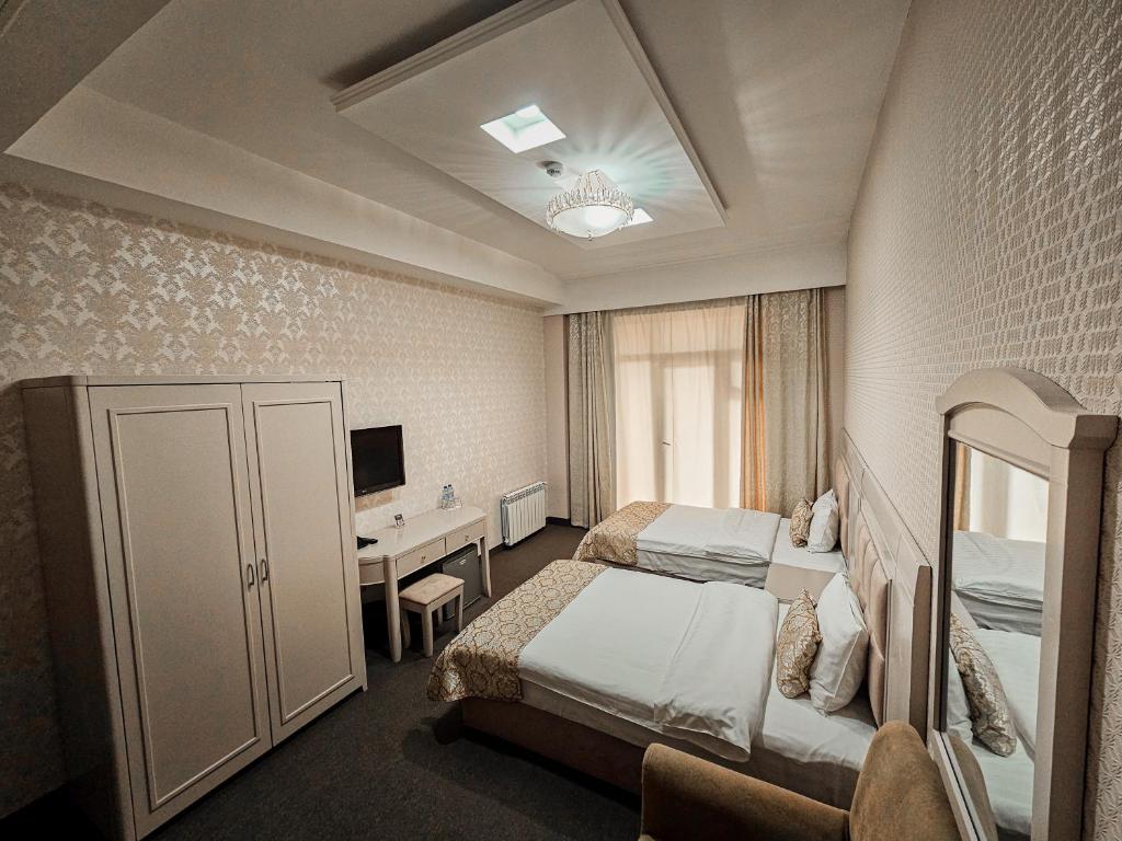 Postel nebo postele na pokoji v ubytování Safran Hotel