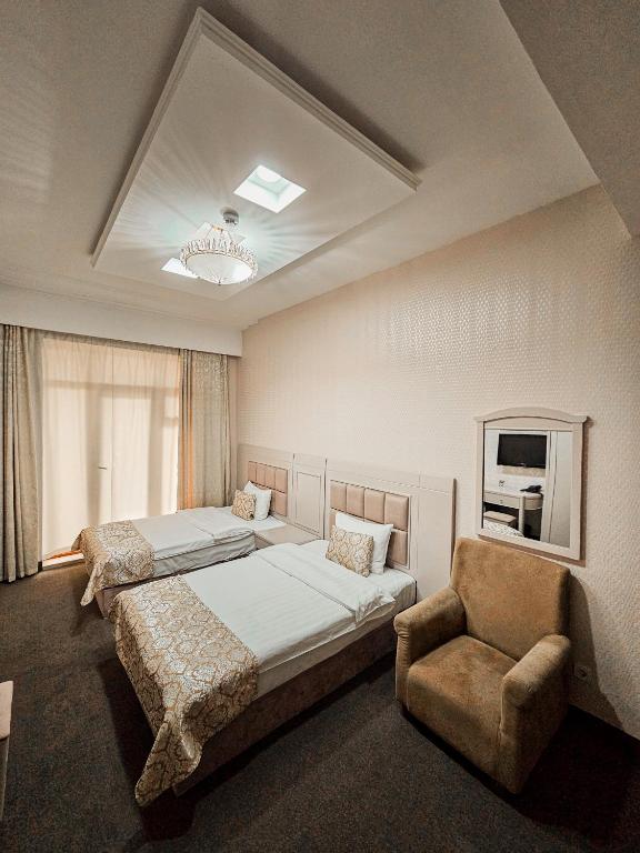 Postel nebo postele na pokoji v ubytování Safran Hotel