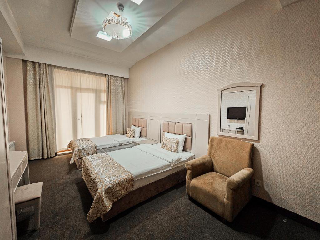 Postel nebo postele na pokoji v ubytování Safran Hotel