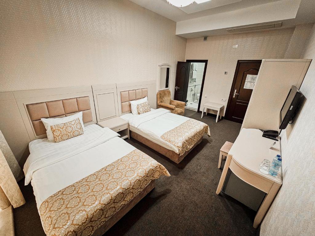 Postel nebo postele na pokoji v ubytování Safran Hotel