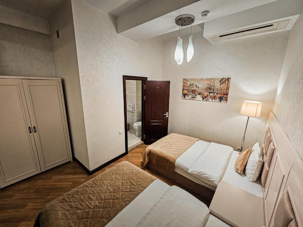 Postel nebo postele na pokoji v ubytování Safran Hotel