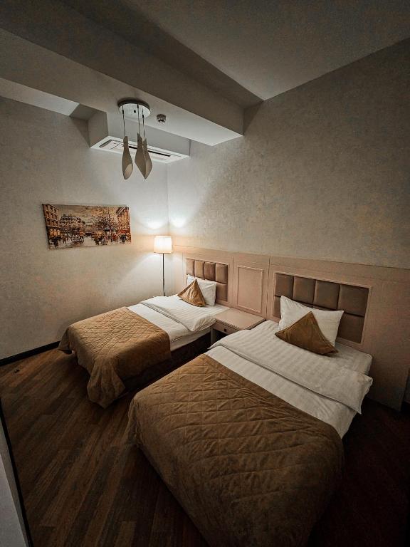 Postel nebo postele na pokoji v ubytování Safran Hotel
