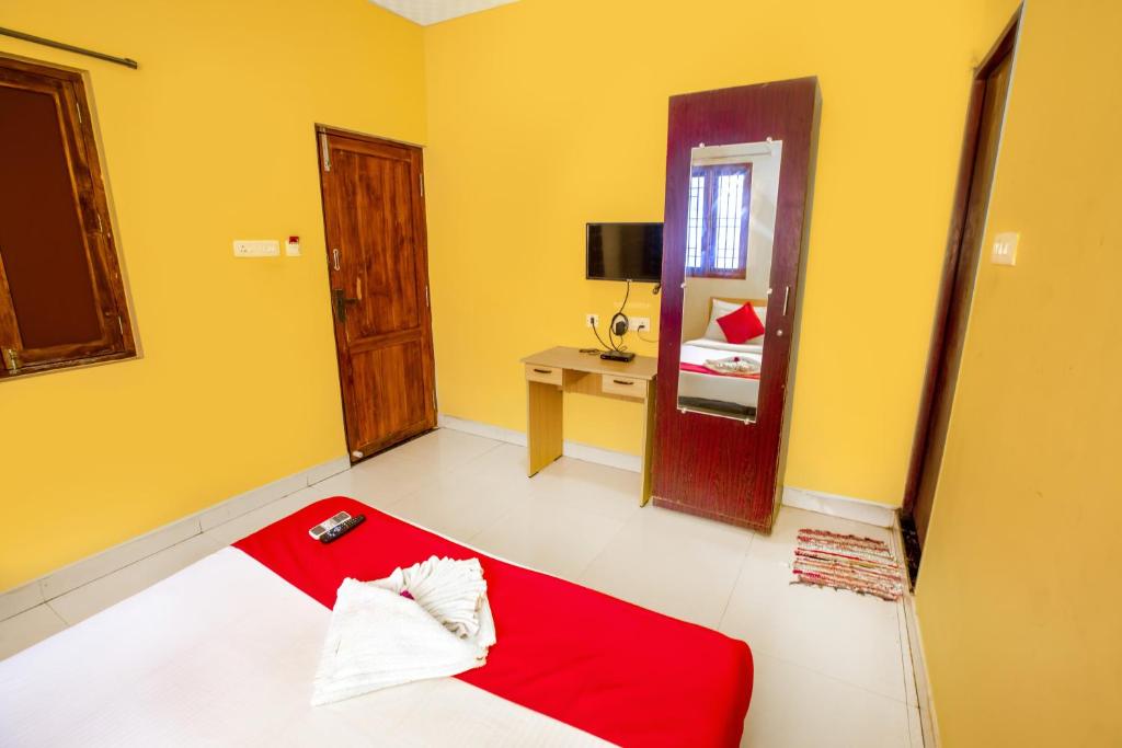 Postel nebo postele na pokoji v ubytování STARLIGHT HOTELs PUDUCHERRY