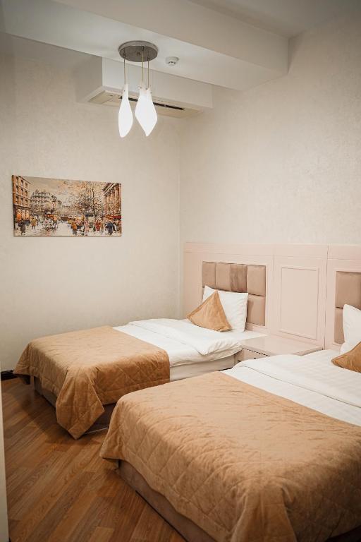 Postel nebo postele na pokoji v ubytování Safran Hotel