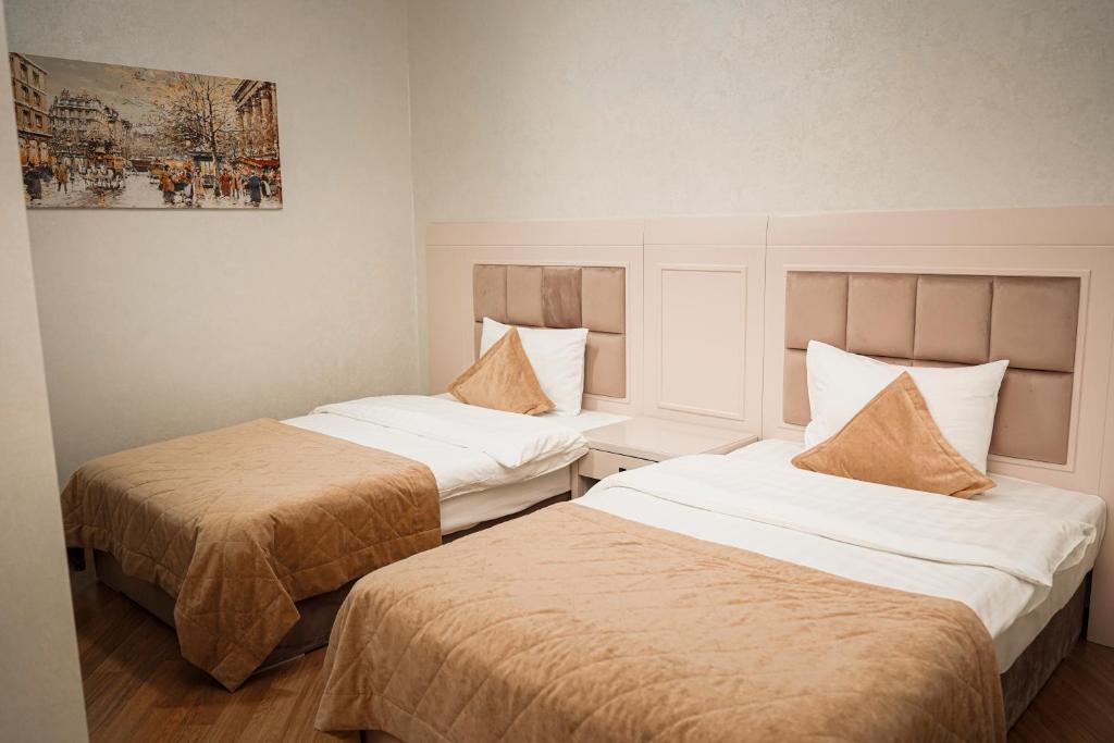 Postel nebo postele na pokoji v ubytování Safran Hotel