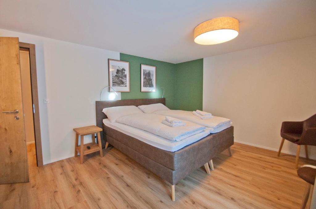 Postel nebo postele na pokoji v ubytování Chalet Aeschhorn