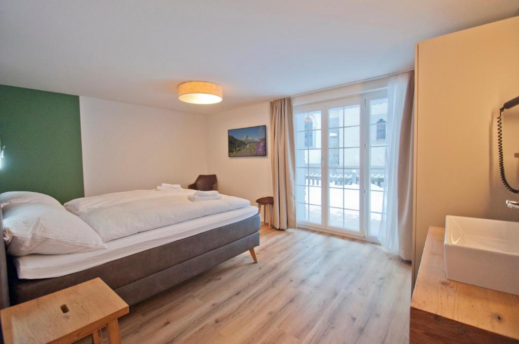 Postel nebo postele na pokoji v ubytování Chalet Aeschhorn