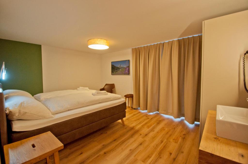Postel nebo postele na pokoji v ubytování Chalet Aeschhorn