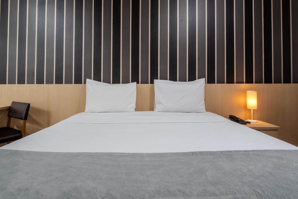 Postel nebo postele na pokoji v ubytování 155 Hotel