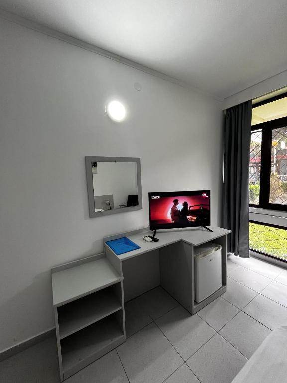 TV a/nebo společenská místnost v ubytování Hotel Callatis