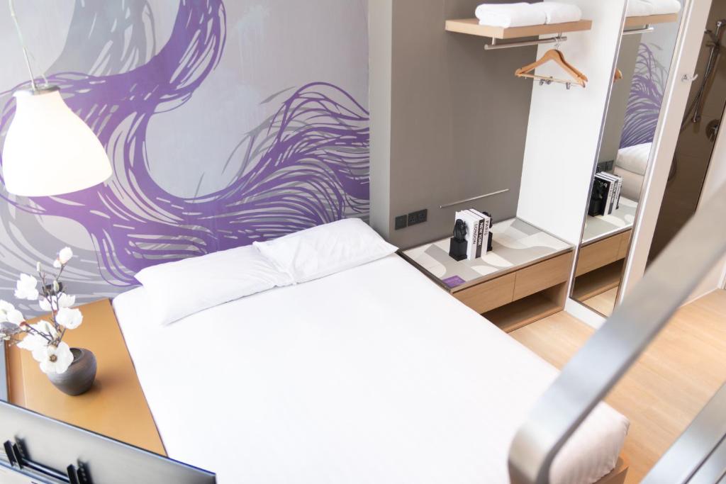 Postel nebo postele na pokoji v ubytování Studio M Hotel