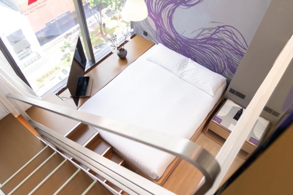 Postel nebo postele na pokoji v ubytování Studio M Hotel