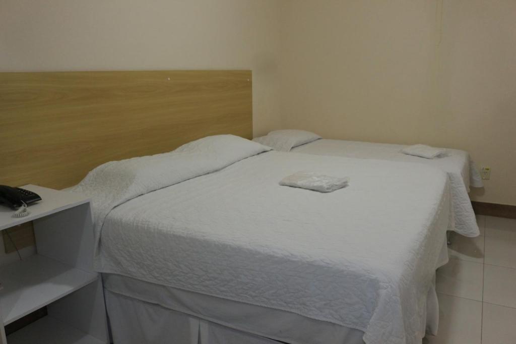 Postel nebo postele na pokoji v ubytování Hotel Absolar
