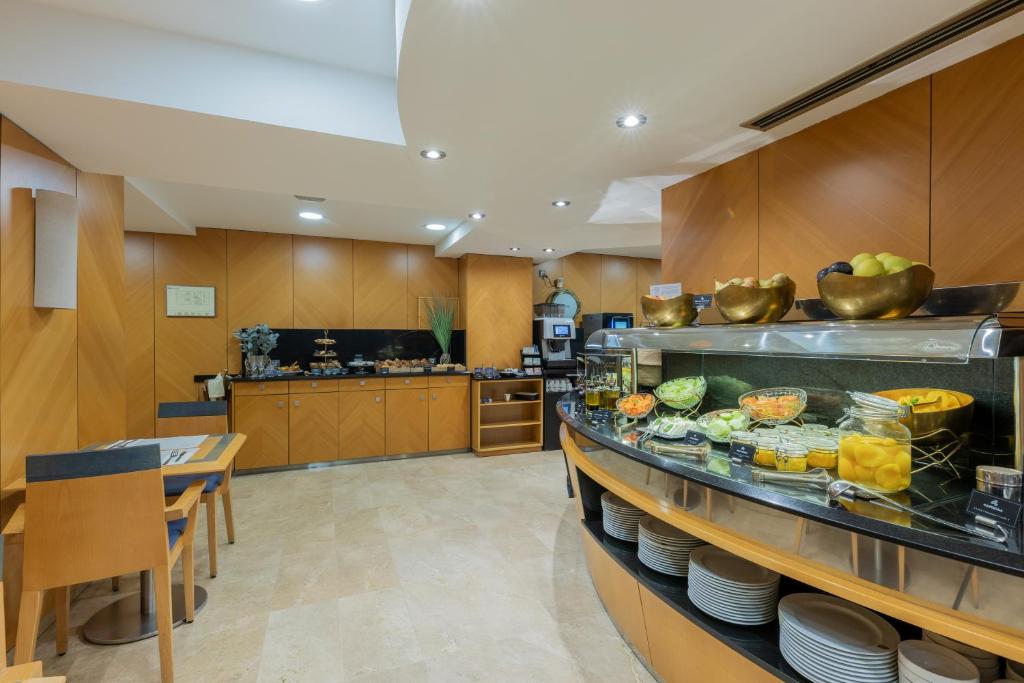 a kitchen with a counter with food on it at Hotel del Mar in Barcelona