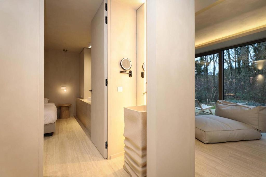 Postel nebo postele na pokoji v ubytování Wellness Suite - 2 personen - Woodz Lodges