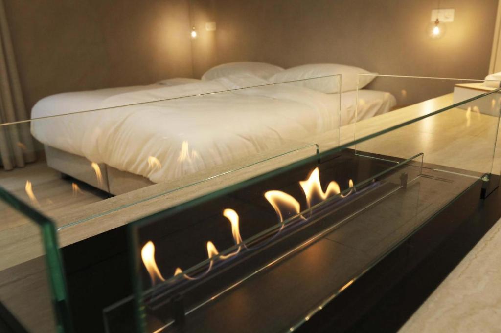 Postel nebo postele na pokoji v ubytování Wellness Suite - 2 personen - Woodz Lodges