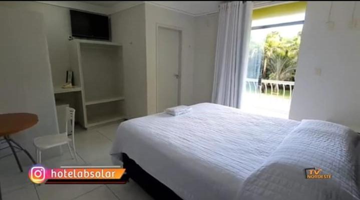 Postel nebo postele na pokoji v ubytování Hotel Absolar