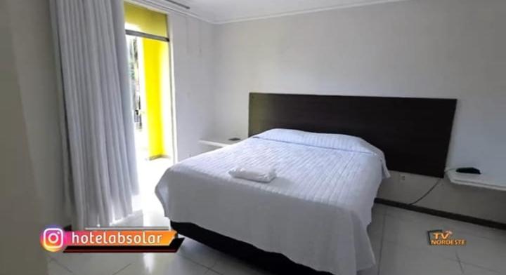 Postel nebo postele na pokoji v ubytování Hotel Absolar