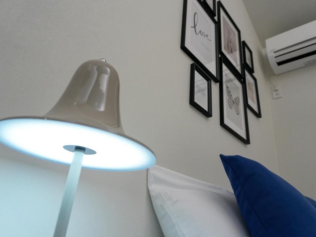 Postel nebo postele na pokoji v ubytování OUCHI HOTEL Onaganishi