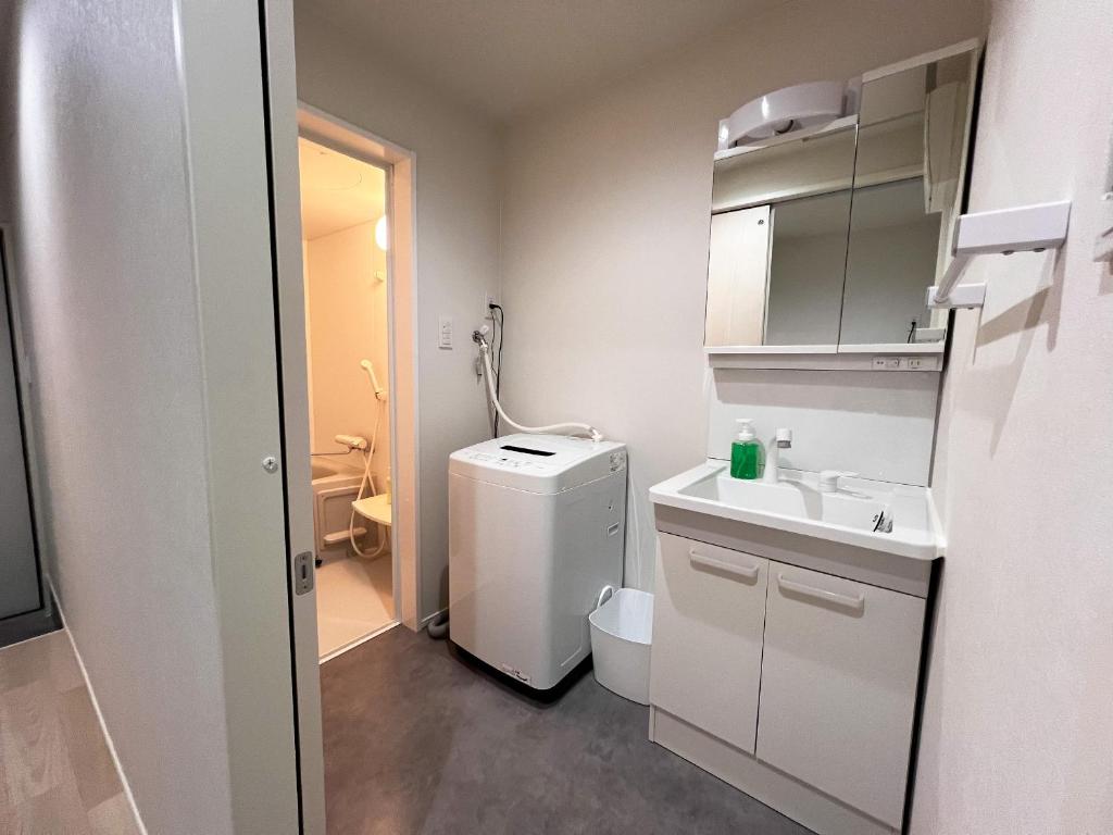 Koupelna v ubytování OUCHI HOTEL Onaganishi