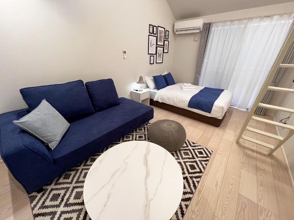 Postel nebo postele na pokoji v ubytování OUCHI HOTEL Onaganishi