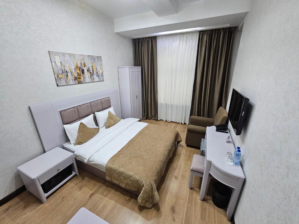 Postel nebo postele na pokoji v ubytování Safran Hotel