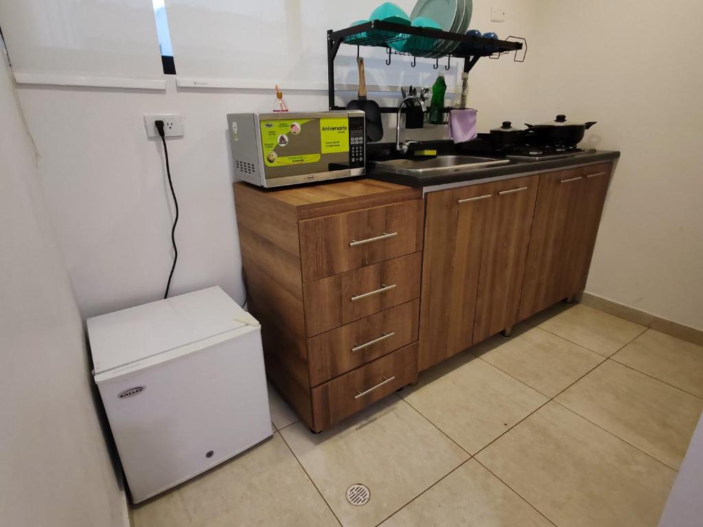 Kuchyň nebo kuchyňský kout v ubytování Aparta-estudio cerca UPTC, clínica de los andes