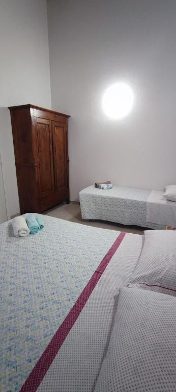 Łóżko lub łóżka w pokoju w obiekcie casa margherita