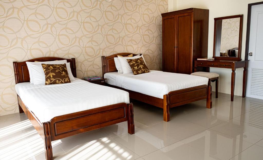 Postel nebo postele na pokoji v ubytování Alisa Krabi Hotel-SHA Plus
