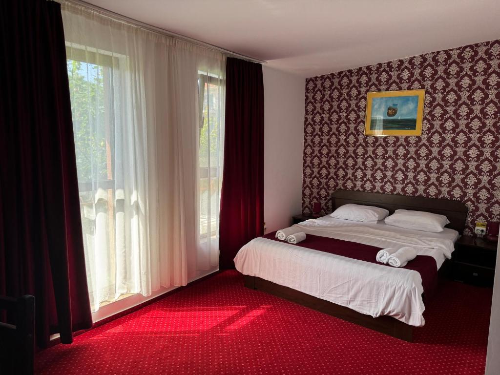 Postel nebo postele na pokoji v ubytování Hotel Hermes