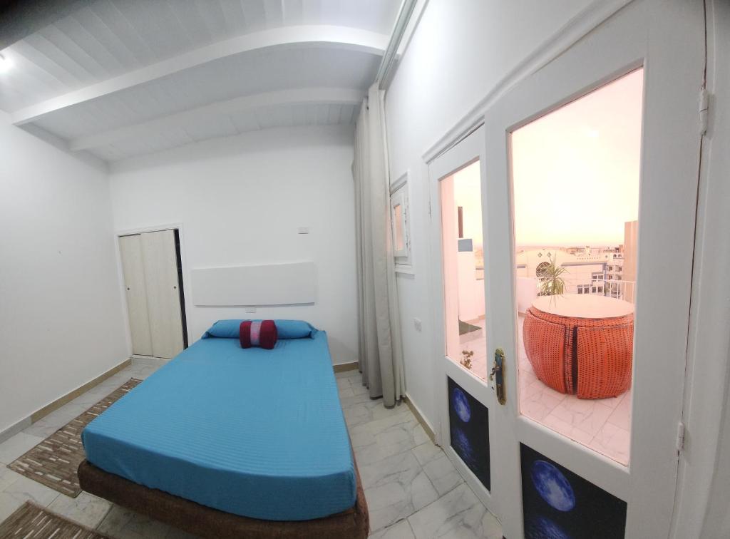 Postel nebo postele na pokoji v ubytování White Roof - Hurghada
