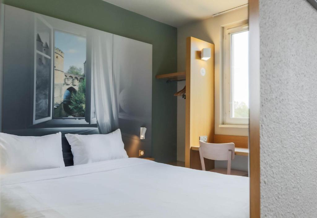 Postel nebo postele na pokoji v ubytování B&B HOTEL Metz Semécourt