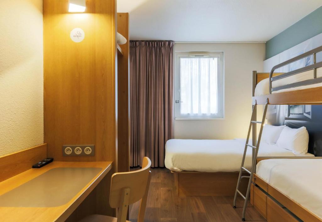 Postel nebo postele na pokoji v ubytování B&B HOTEL Metz Semécourt